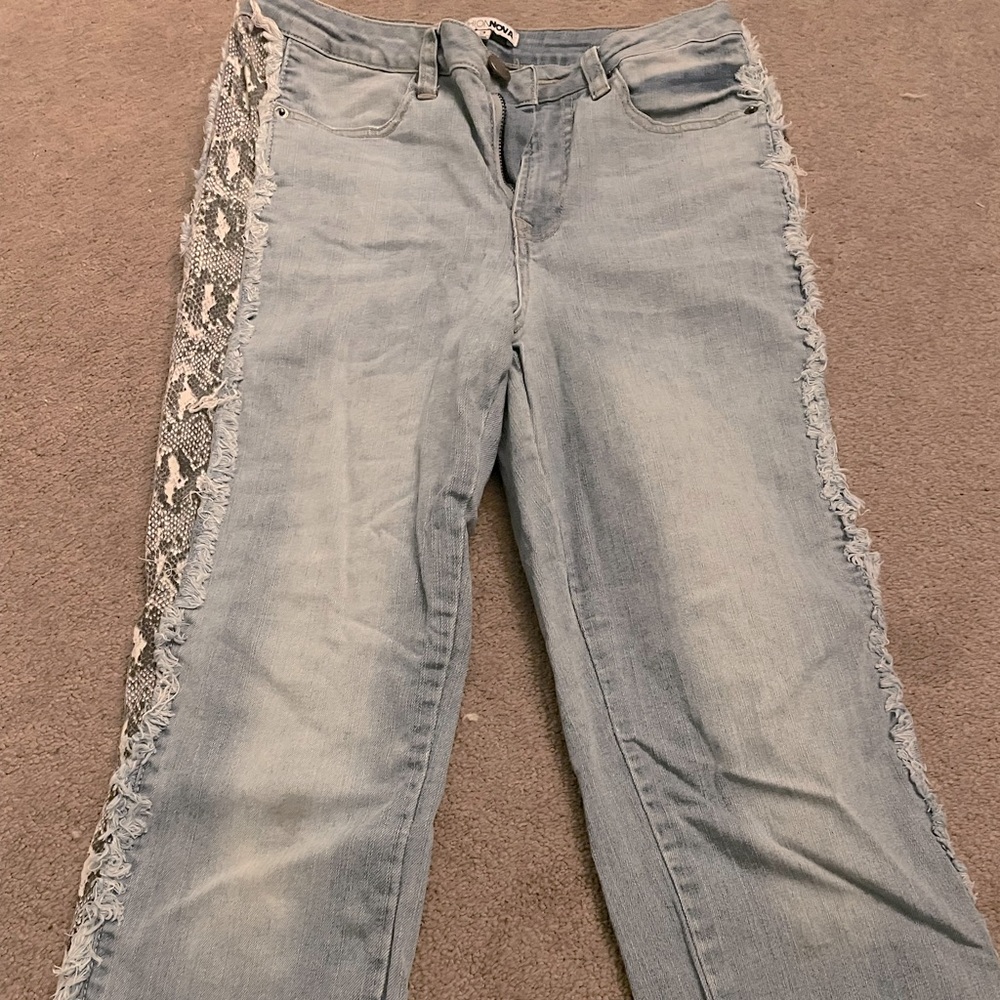 Mom jeans. light washed with snakeskin print on side.